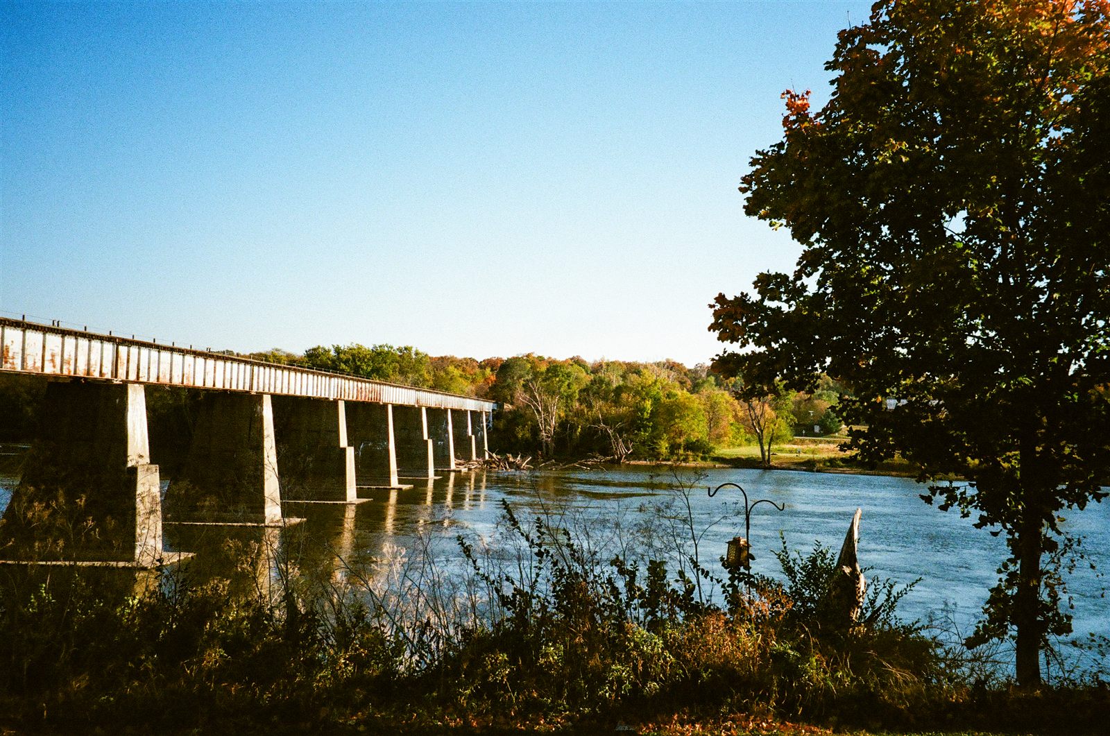 Railroad bridge from the bank — Lightroom edit